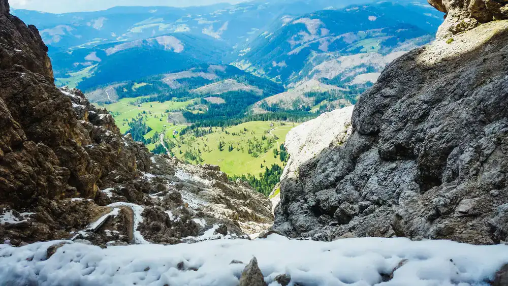 A high alpine ridge trail with expansive valley views