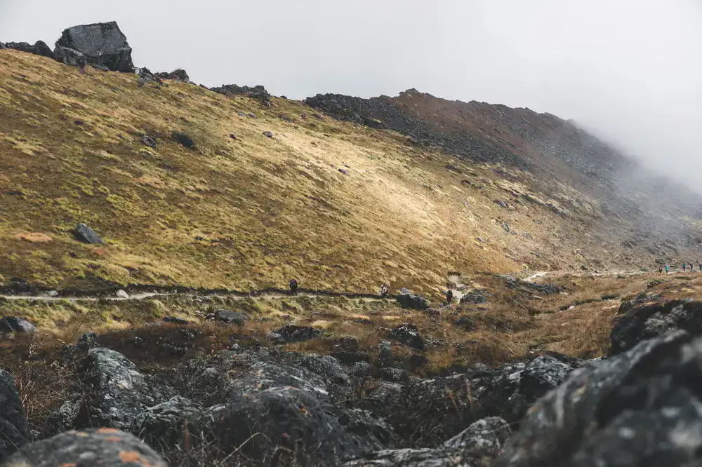 A steep rocky path ascending a mountain pass