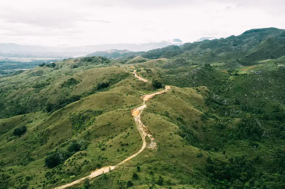 Gentle trail winding through a lush mountain valley